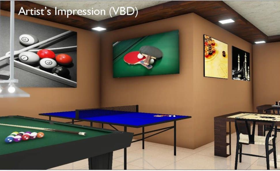 The multi-purpose hall: a pool table and a table tennis table under framed prints