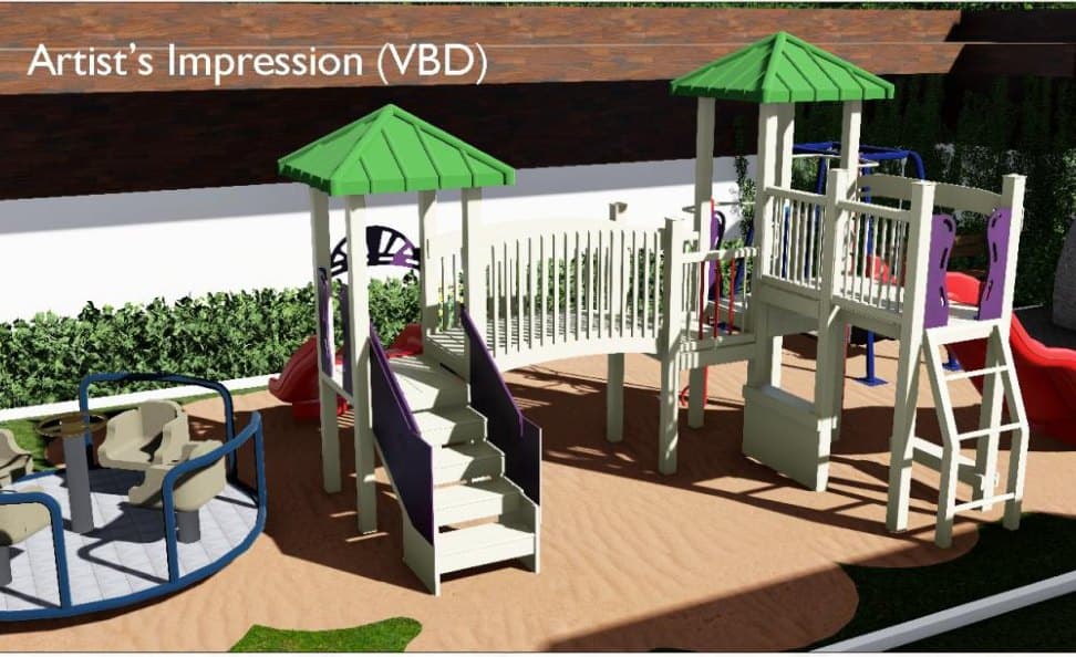 The children's play area: a climbing frame with a slide and a roundabout on a terrace