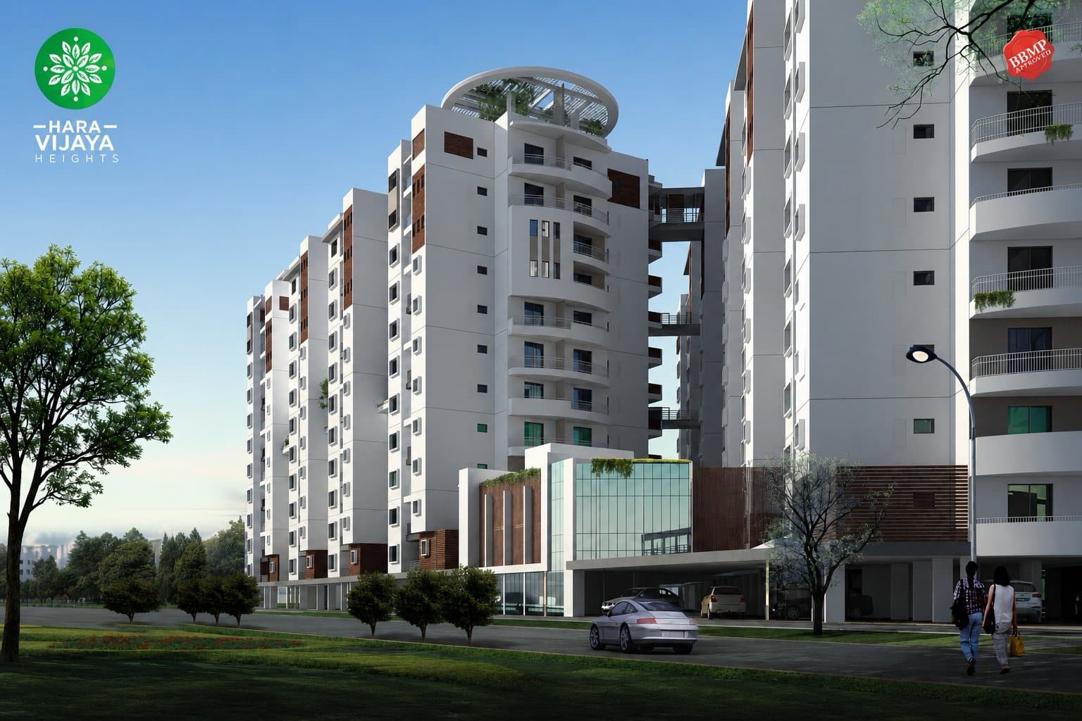 The towers from the approach road, with the glazed entrance lobby at the base
