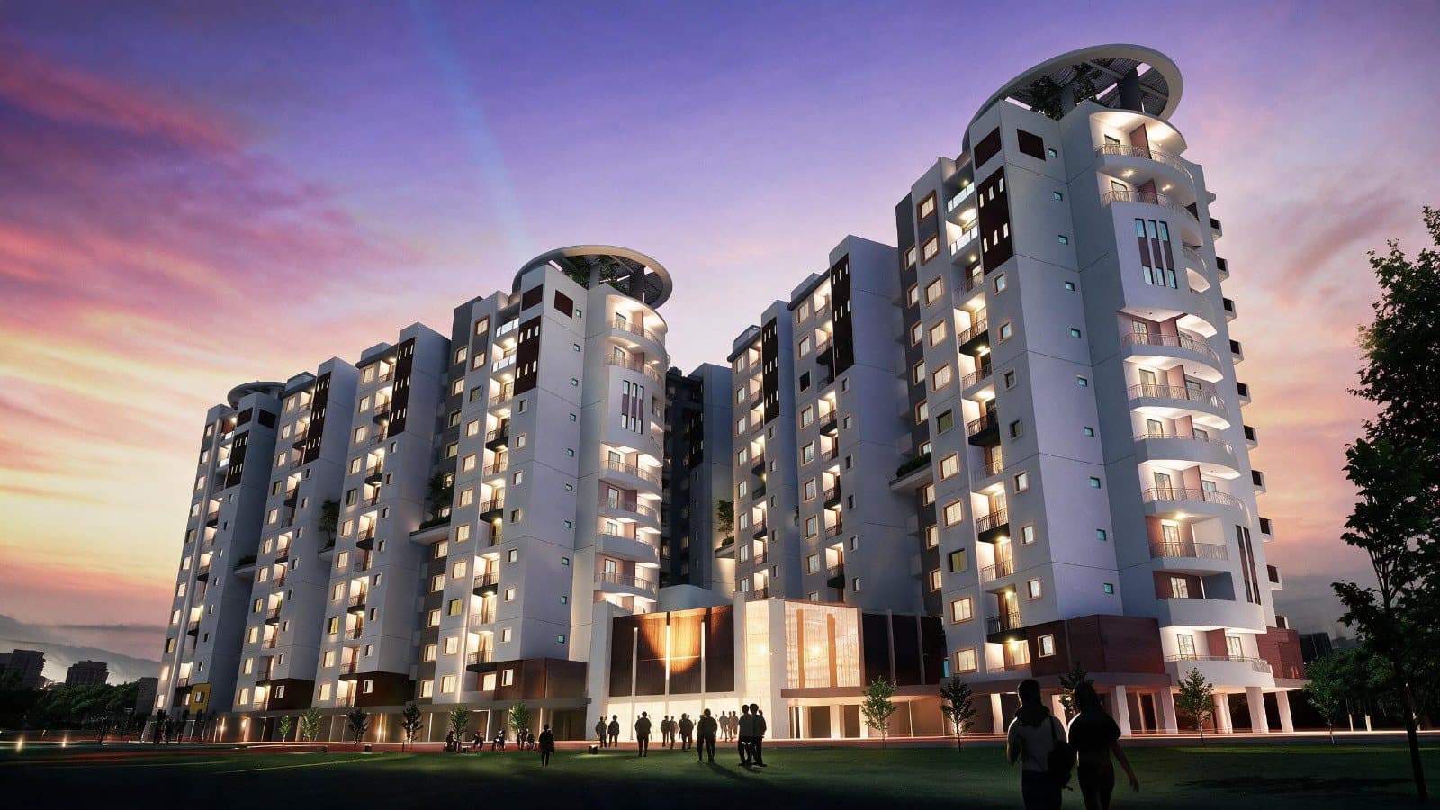 The development lit at dusk under a violet sky, with residents crossing the lawn