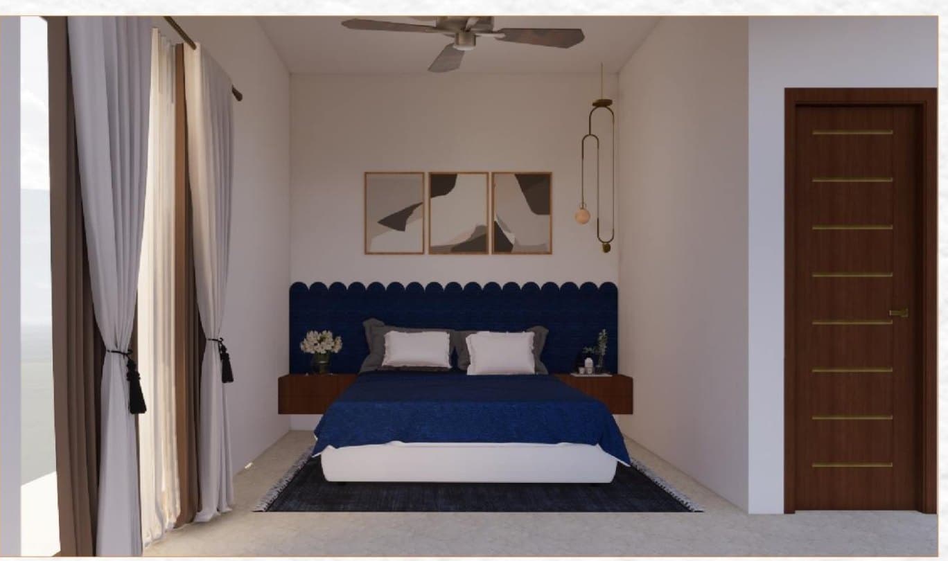 A bedroom with a navy channelled headboard, a timber door and a ceiling fan