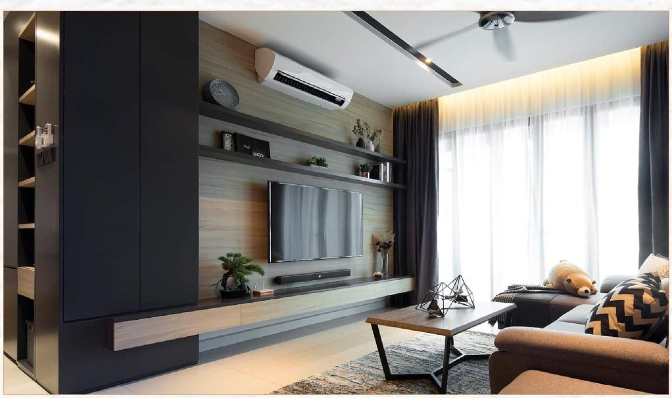 A living room with a panelled television wall, sheer curtains and a grey sofa