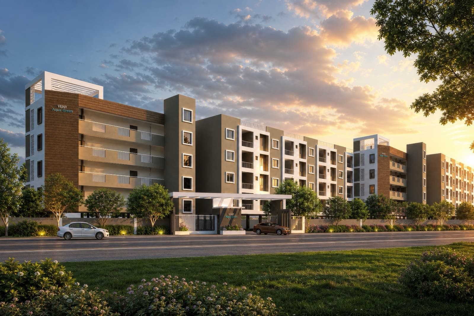 Vijay Aqua Green at sunset, its low blocks running back along the road behind a planted verge