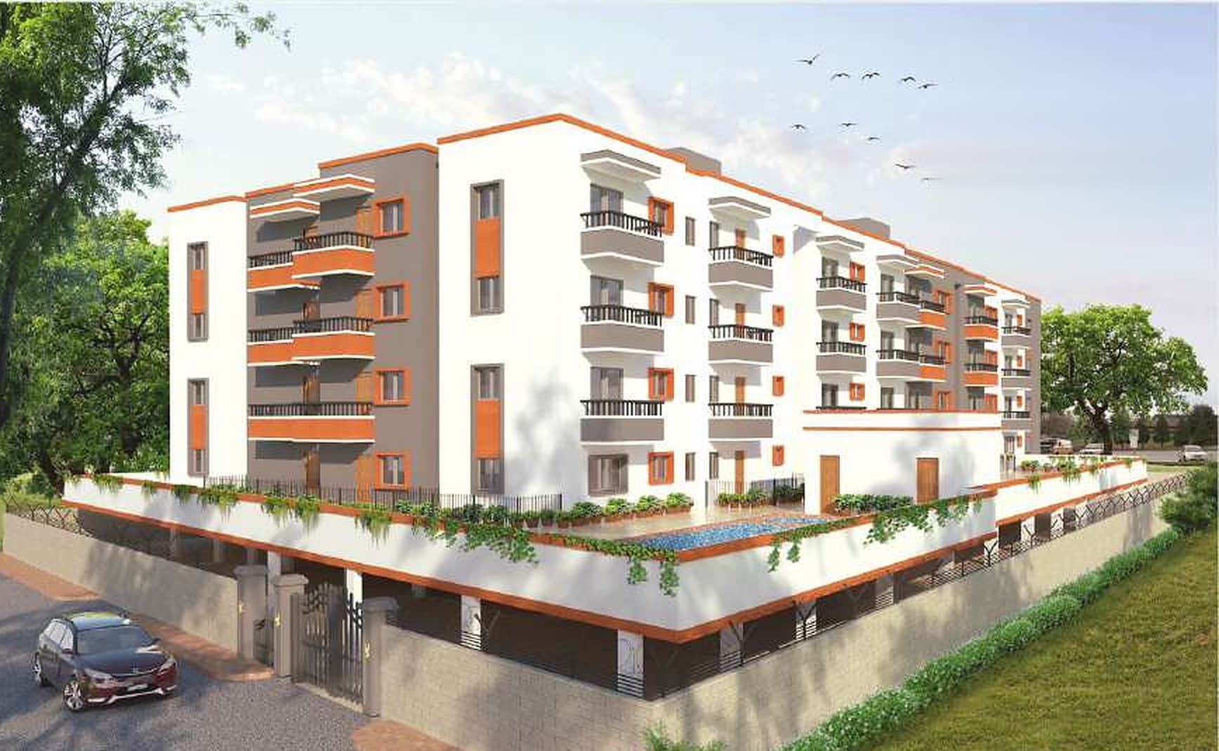 Architectural view of Vijaya Nisarga: a white four-storey apartment block with orange and grey balconies over a walled podium, a pool on the podium deck, planters trailing over its edge and a car at the gate